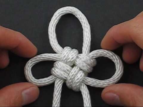 white paracord tied in a flower knot