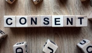 consent spelt out in wooden blocks