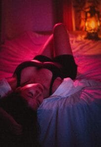 Domme laying in bed