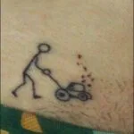 tattoo of man with lawn mower in pubic hair