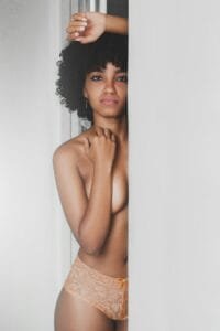 naked woman behind door