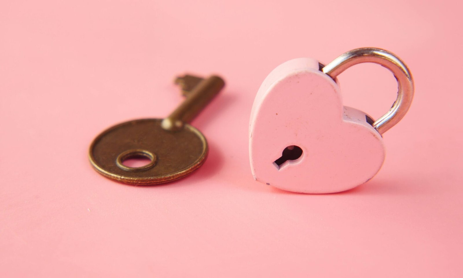 a pink padlock and key