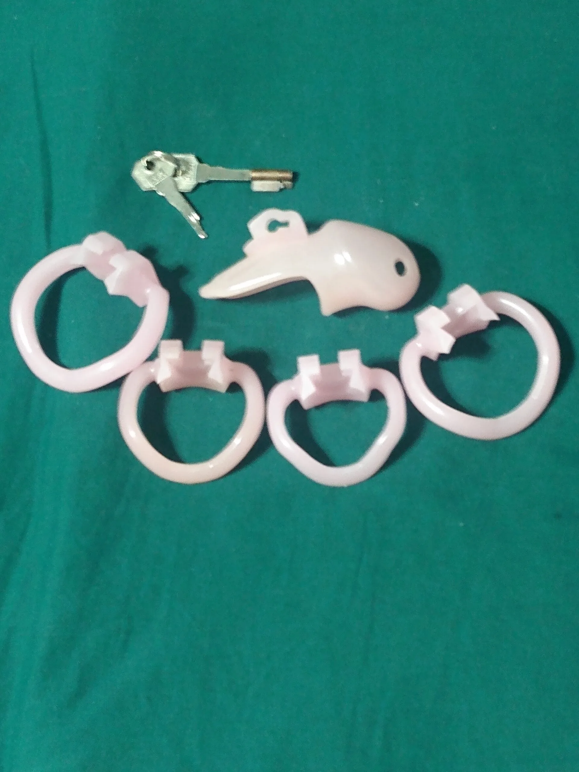 pieces allowing for correctly sized chastity cage