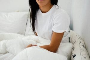 lady clothes in white bed