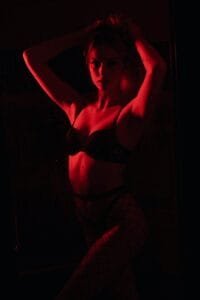a Domme woman in the shadows